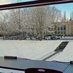 View of snow-covered library lawn from inside Central Library