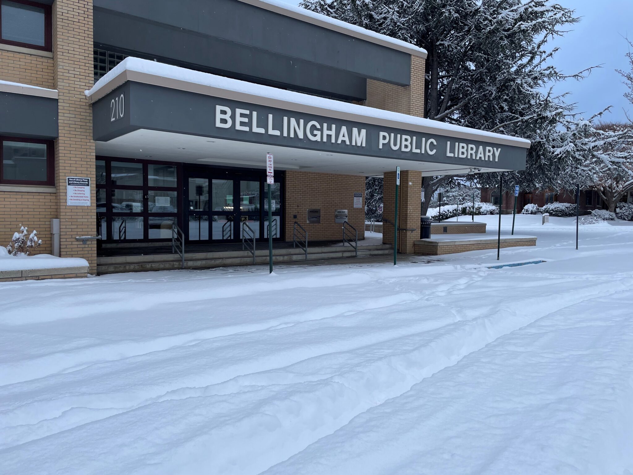 Library closed due to winter weather. Deep snow in front of Library entrance.