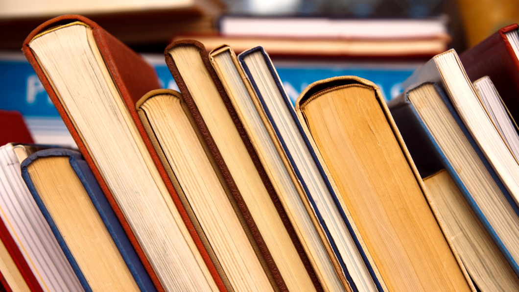 sideways stack of used books