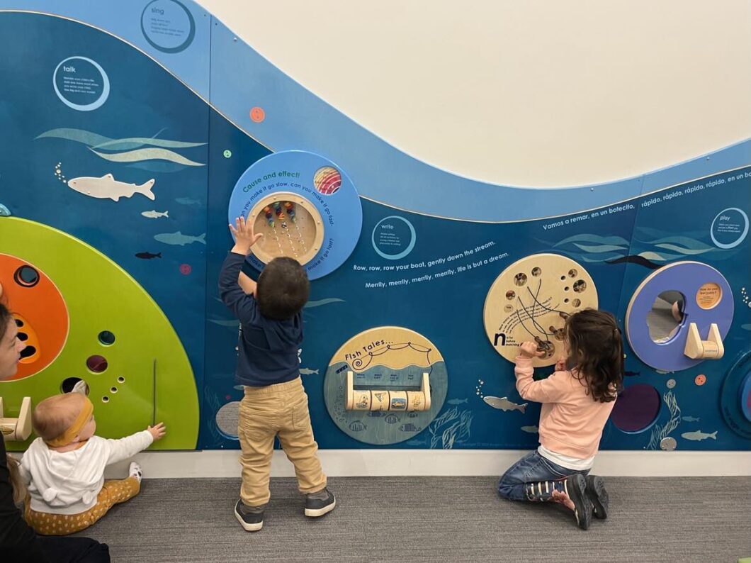 Children playing with interactive wall at Bellingham Public Library