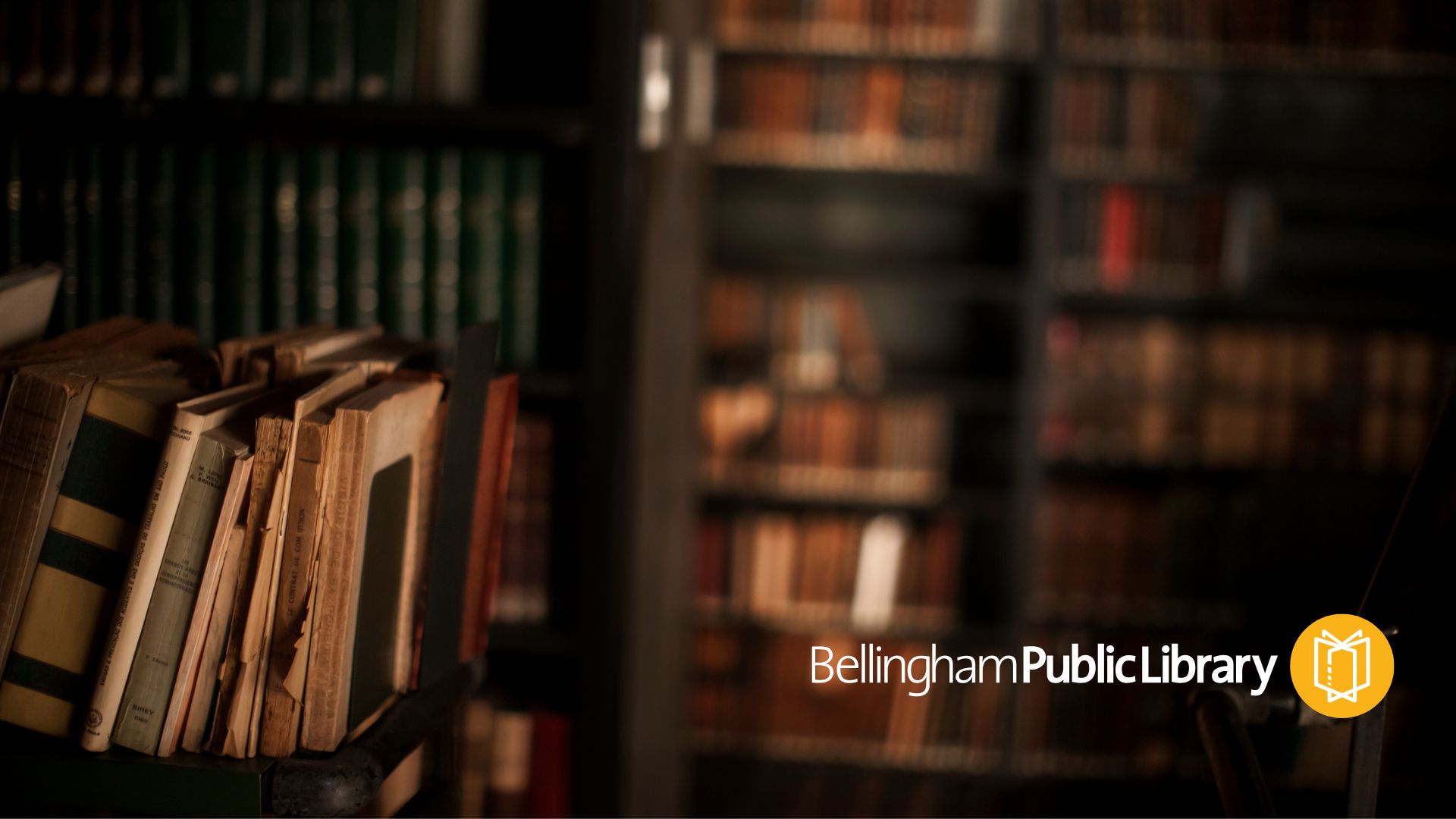 Image is of a dark library filled with old books