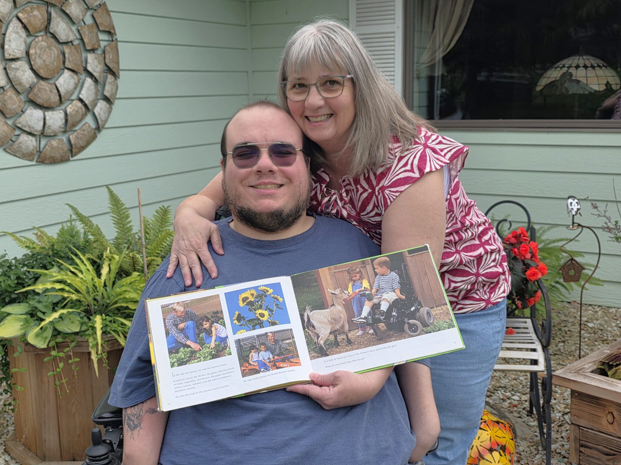Mother hugs son in wheelchair
