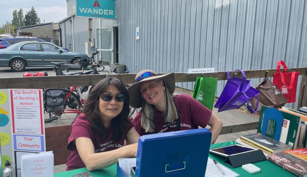 Volunteers sell books at Wander Brewing