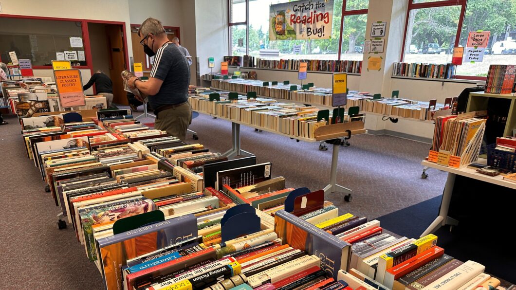 A shopper browsing at the book sale.