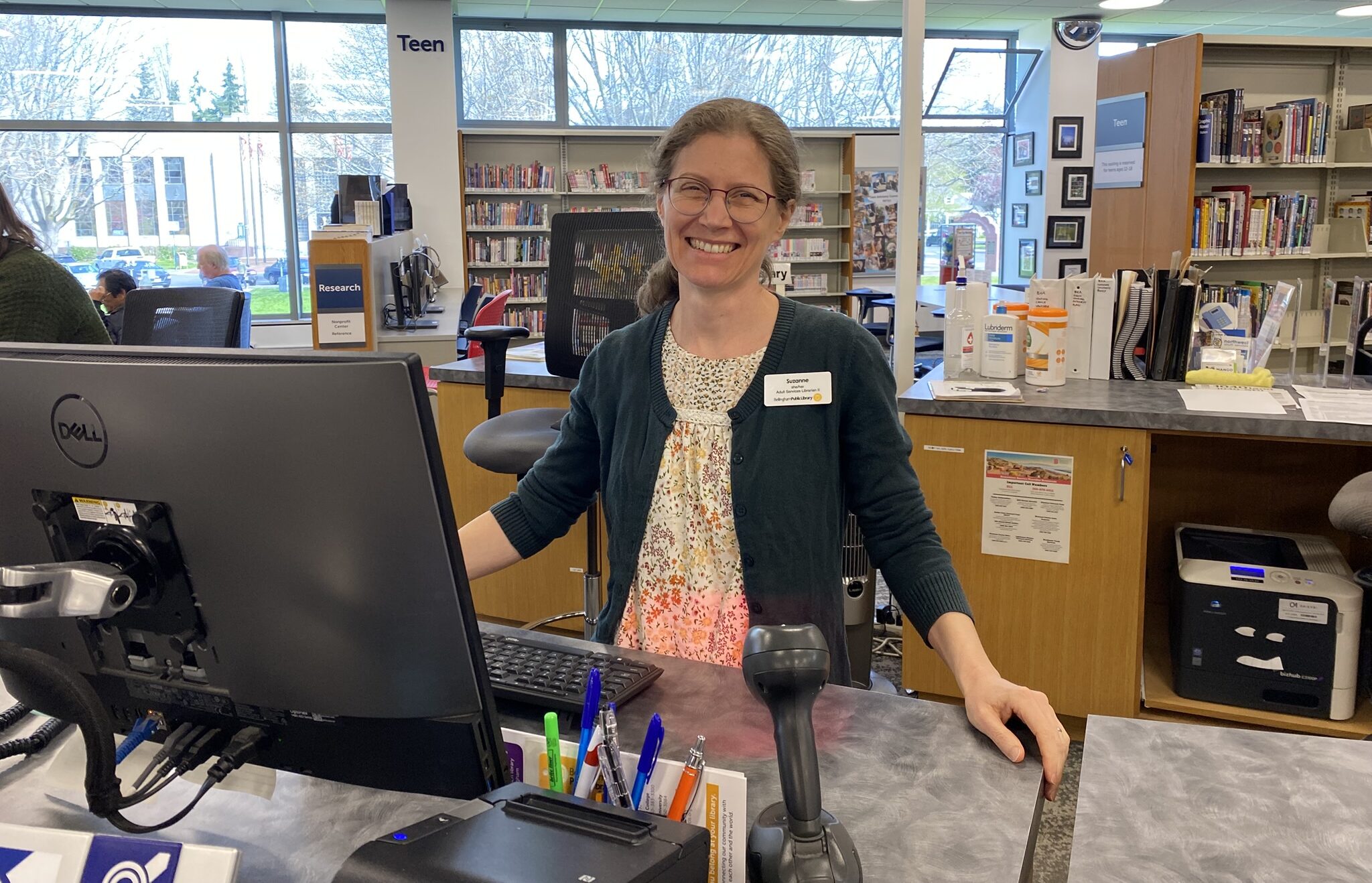 Librarian at the help desk computer