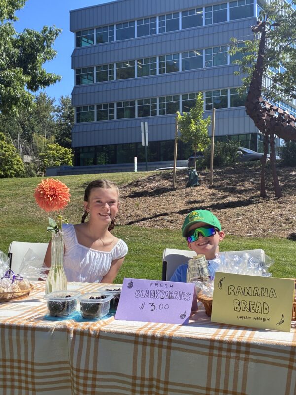 Children selling blackberries and banana bread